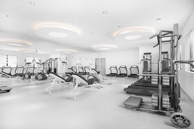 A gym with equipment for health and fitness training