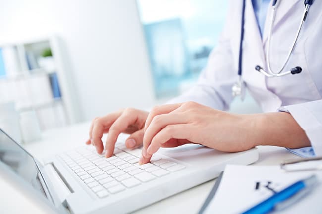 A medical professional reviewing patient data
