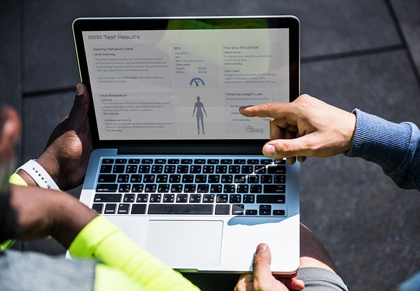 Resting Metabolic Rate test results reviewed on a laptop