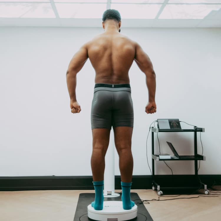 Person standing on 3D body scanner