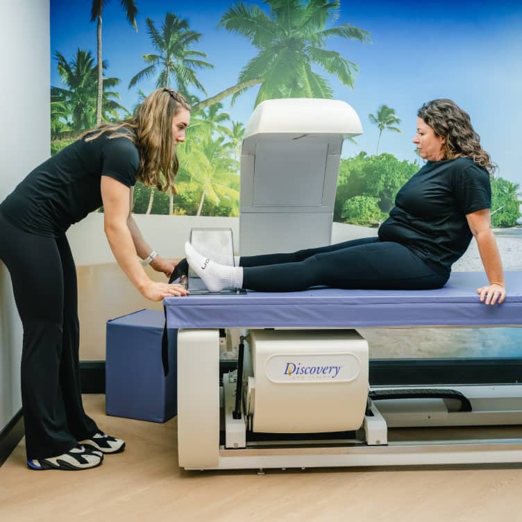 Patient positioned on DEXA scanner for hip scan