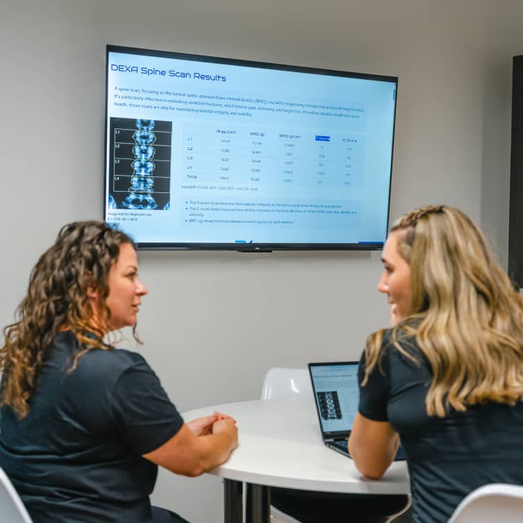 Consultant explaining DEXA body composition results