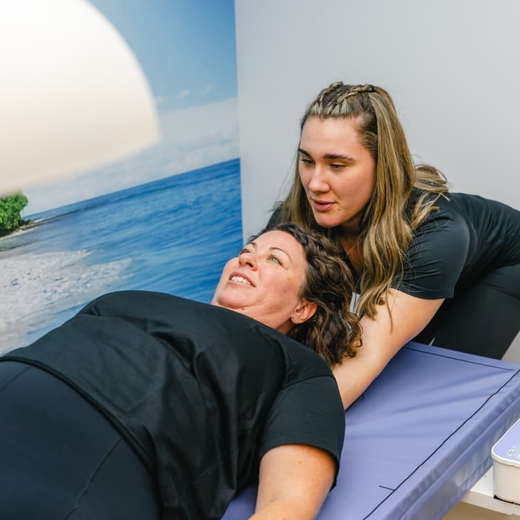 Consultant reviewing weight loss results with client